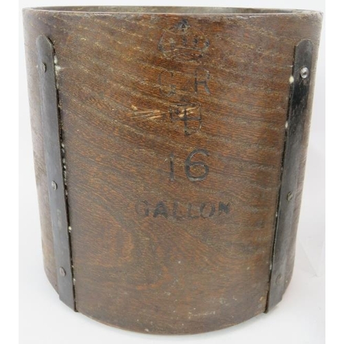 92 - A wooden gallon measure stamped GR, two Victorian pewter measures, four pewter 20th Century measures... 