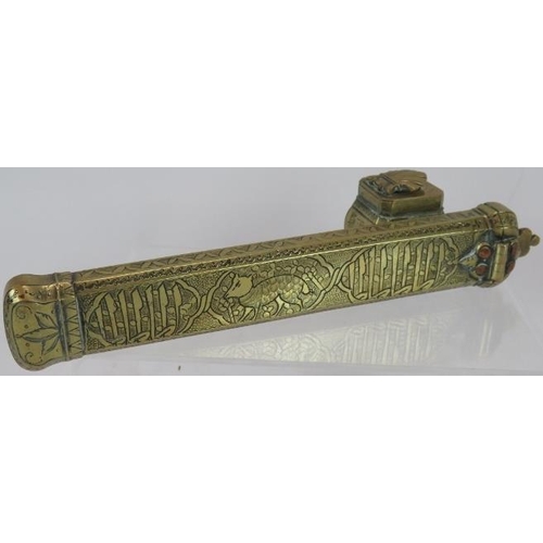 93 - An Indo-Persian brass Qalamdan Scribes pen box and inkwell, engraved with script and animal figures,... 