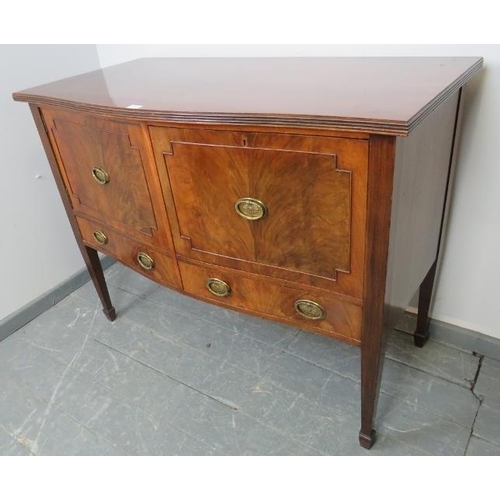 702 - An Edwardian flame mahogany sideboard with reeded edge, housing one cupboard and one deep drawer wit... 