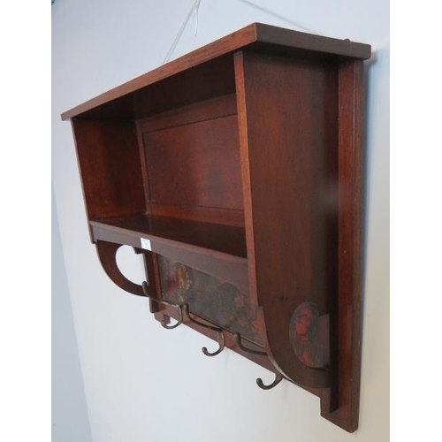 705 - An Arts & Crafts mahogany wall hanging bookshelf with painted frieze under depicting a medieval scen... 