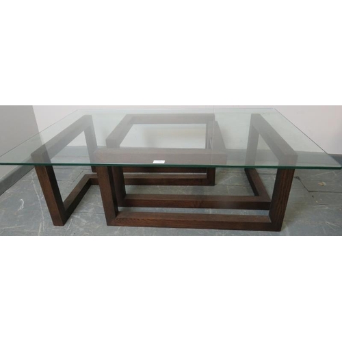 708 - A modernist rectangular coffee table with glass top raised on an asymmetric oak base.
Condition repo... 