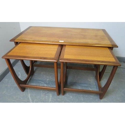 709 - A set of three rectangular Astro crossbanded teak nesting tables by G Plan, on curved supports with ... 