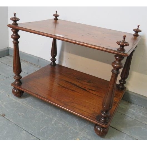 710 - A Victorian rosewood two tier whatnot, with finials and reeded uprights, on fluted ball feet with re... 