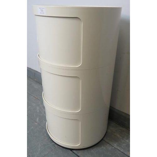 713 - A mid-century modern white acrylic drum cabinet by Kartell, of three compartments with sliding doors... 