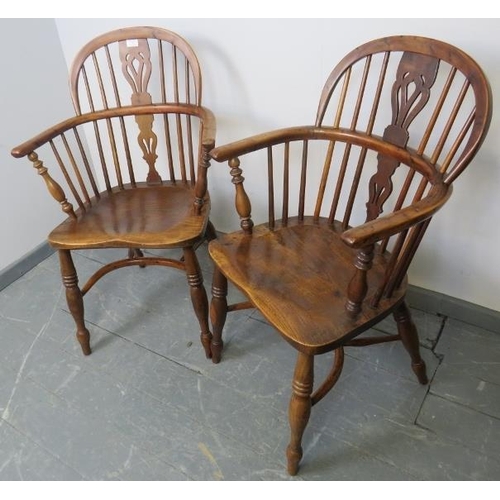 715 - A pair of Georgian elm and yew wood hoop back Windsor chairs of excellent colour, with shaped and pi... 