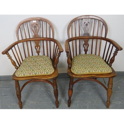 715 - A pair of Georgian elm and yew wood hoop back Windsor chairs of excellent colour, with shaped and pi... 