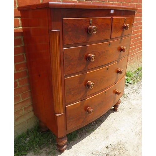 720 - An early Victorian mahogany chest of two short over three long graduated drawers with original turne... 