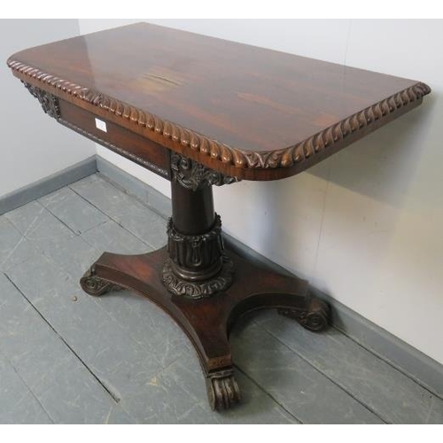 726 - A Willian IV rosewood turnover card table, with gadrooned edging and carved frieze, on a tapering pe... 