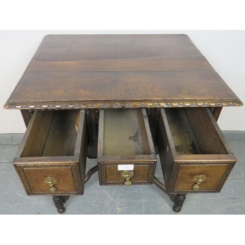 728 - A 19th century oak lowboy in a 17th century taste, housing three short drawers with cast brass drop ... 