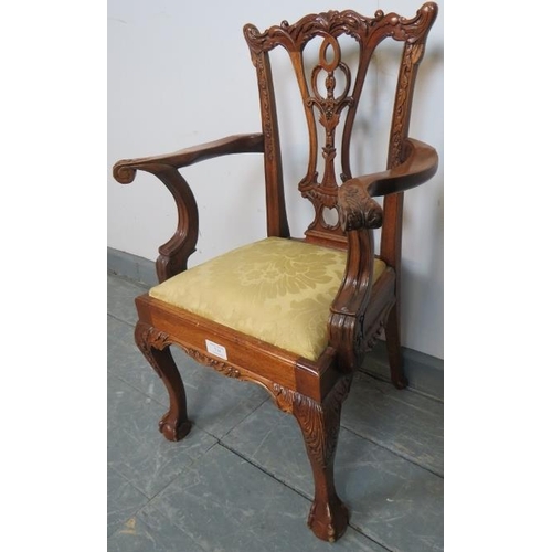 734 - A vintage mahogany child’s chair in the Chippendale taste, with acanthus carving, on claw & ball fee... 