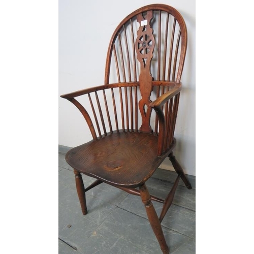 740 - A Georgian elm and yew wood hoop-back Windsor chair of excellent colour, on turned supports with an ... 