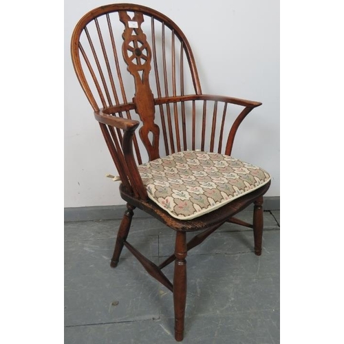 740 - A Georgian elm and yew wood hoop-back Windsor chair of excellent colour, on turned supports with an ... 