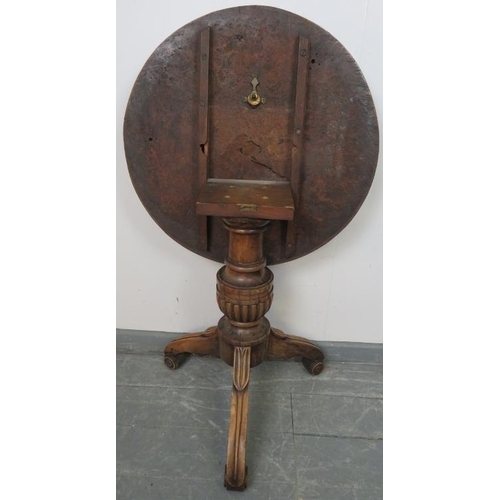 742 - A  fine early 19th century circular tilt top table with solid burr walnut top, on a mahogany tripod ... 