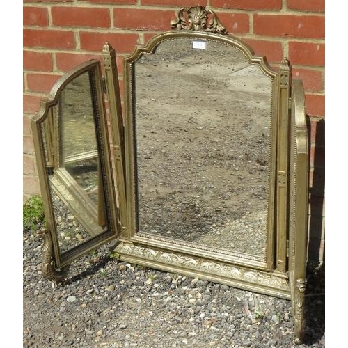 744 - An antique style gilt gesso triptych mirror, the ornate surround with shell cornice and mythical cre... 