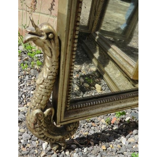 744 - An antique style gilt gesso triptych mirror, the ornate surround with shell cornice and mythical cre... 