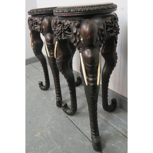 749 - A pair of antique tropical hardwood jardinieres/plant stands with inset red marble tops, the finely ... 