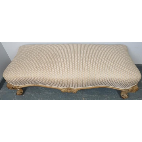 750 - An antique beech shaped front low stool in the French taste, upholstered in gold and cream striped m... 