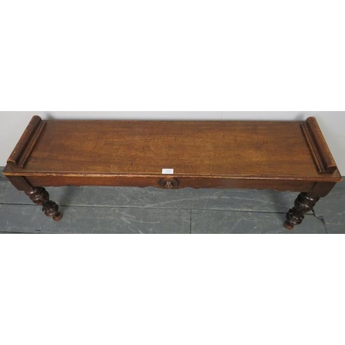 751 - A Victorian mahogany window seat, with shaped frieze and applied roundels, on tapering turned fluted... 