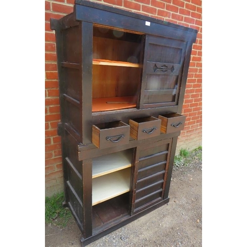 756 - An antique Japanese ebonised two section Mizuya Tansu (kitchen chest) housing three short drawers wi... 