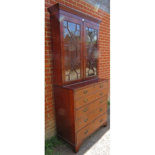 757 - A Georgian mahogany secretaire bookcase strung with satinwood, the top section with astral glazed do... 