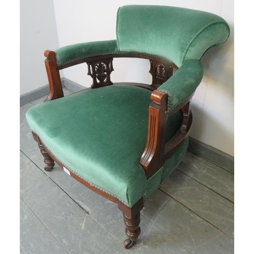 774 - An Edwardian mahogany tub chair, with carved and pierced backrest, upholstered in teal velvet, on ta... 