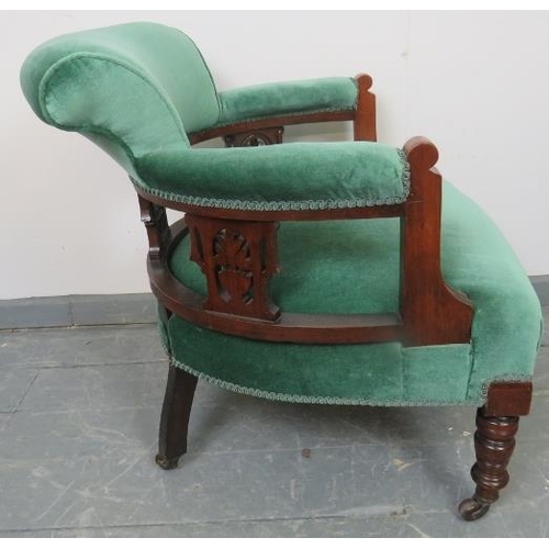 774 - An Edwardian mahogany tub chair, with carved and pierced backrest, upholstered in teal velvet, on ta... 