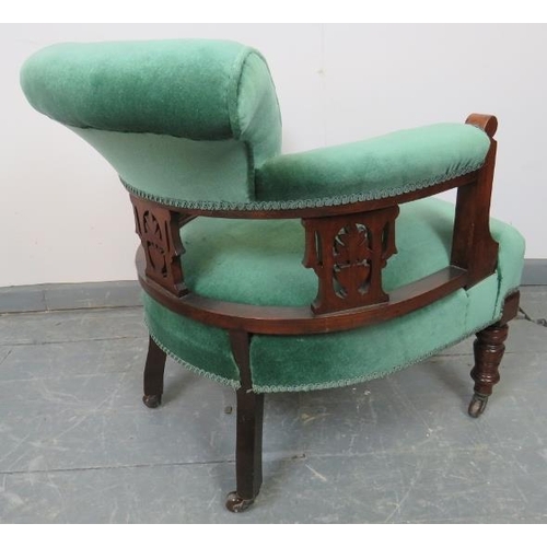 774 - An Edwardian mahogany tub chair, with carved and pierced backrest, upholstered in teal velvet, on ta... 