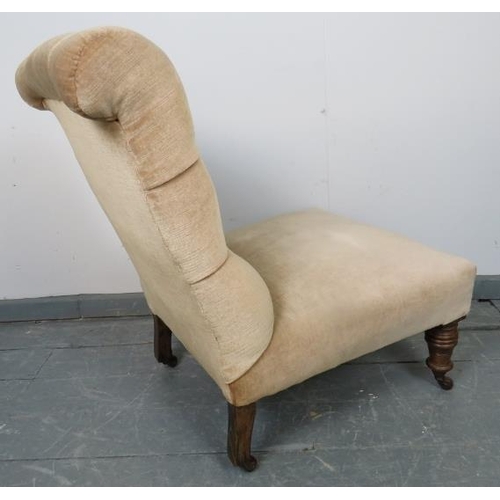 775 - A late Victorian nursing chair, upholstered in buttoned beige draylon material, on tapering turned s... 