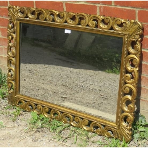 779 - A vintage giltwood framed rectangular wall mirror in the Florentine style. 
Condition report: No iss... 