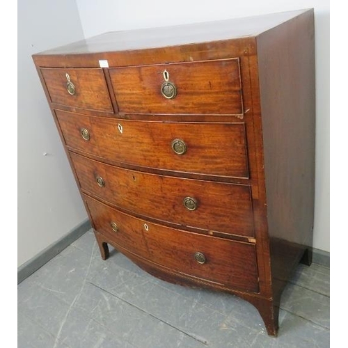 782 - A Regency Period mahogany bow fronted chest of two short over three long graduated cock-beaded drawe... 