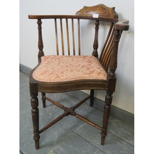 785 - An Edwardian mahogany corner chair, strung with satinwood and featuring rosewood marquetry inlay, on... 