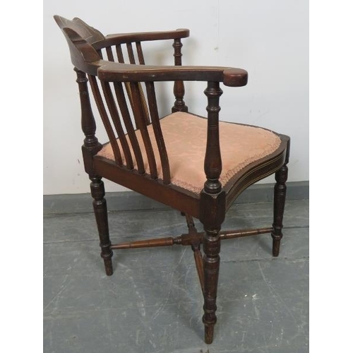 785 - An Edwardian mahogany corner chair, strung with satinwood and featuring rosewood marquetry inlay, on... 