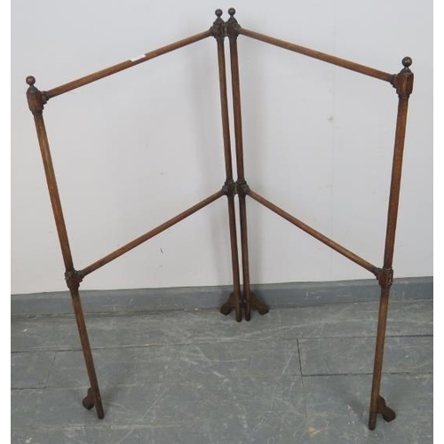 787 - An Edwardian mahogany folding double towel rail, on splayed supports. With brass hook and catch. 
Co... 