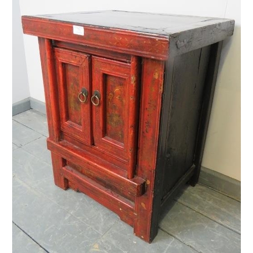 792 - A vintage Chinese red lacquer two door side cabinet, hand painted in black and gold with figural sce... 