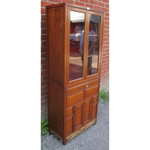 799 - A 20th century Chinese hardwood display cabinet, the glazed upper section housing two shelves, the b... 