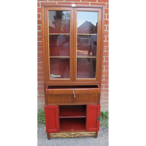 799 - A 20th century Chinese hardwood display cabinet, the glazed upper section housing two shelves, the b... 