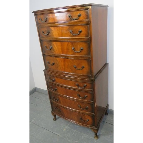 801 - A diminutive reproduction Georgian style walnut chest on chest, having eight graduated drawers with ... 