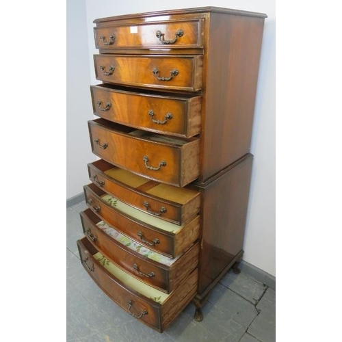 801 - A diminutive reproduction Georgian style walnut chest on chest, having eight graduated drawers with ... 