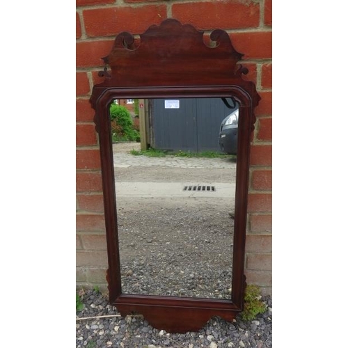 803 - A Georgian mahogany rectangular wall mirror in a shaped and scrolled surround.
Condition report: No ... 