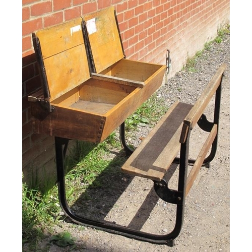 804 - A Victorian/Edwardian beech double school desk, with two rising lids, on cast iron frame. 
Condition... 