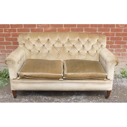 807 - An Edwardian mahogany button backed two-seater sofa, upholstered in beige draylon with rope braiding... 