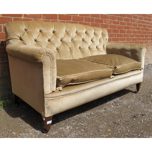 807 - An Edwardian mahogany button backed two-seater sofa, upholstered in beige draylon with rope braiding... 