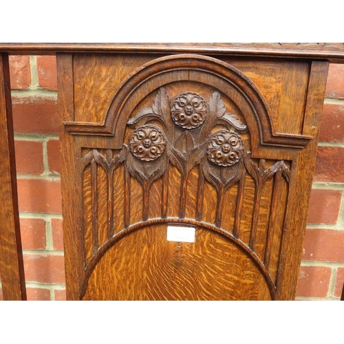 814 - An Edwardian oak single bed with foliate carved head and foot boards and sprung mattress squab. 
Con... 