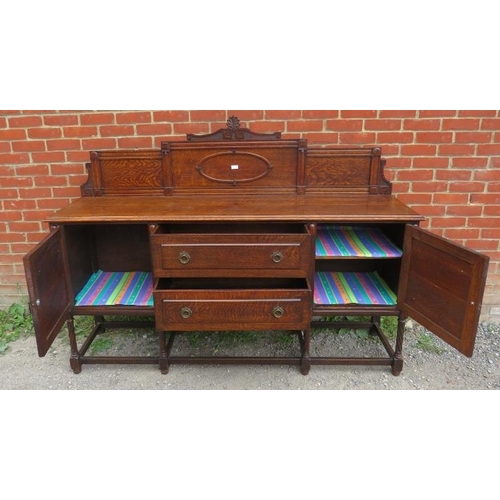 816 - A turn of the century oak sideboard c.1900, with rear gallery carved with Greek key motifs, over two... 