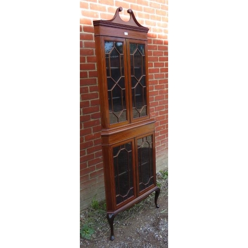 820 - An Edwardian mahogany glazed tall freestanding corner unit, inlaid and crossbanded and strung with b... 