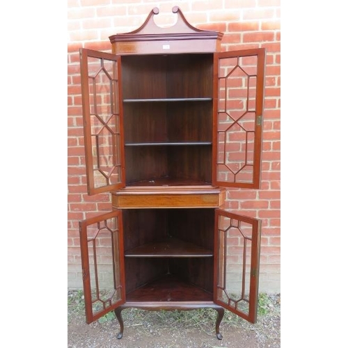 820 - An Edwardian mahogany glazed tall freestanding corner unit, inlaid and crossbanded and strung with b... 