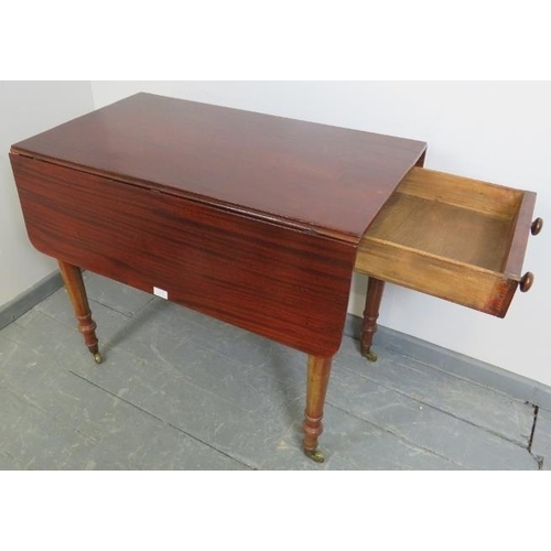 822 - An early Victorian mahogany Pembroke table, with single drawer and dummy drawer, on tapering turned ... 