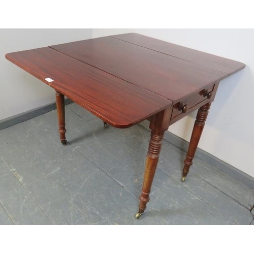 822 - An early Victorian mahogany Pembroke table, with single drawer and dummy drawer, on tapering turned ... 