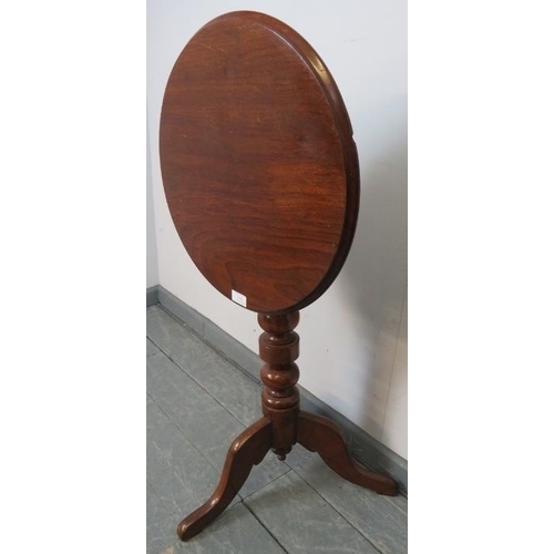 825 - A 19th century mahogany circular tilt top wine table, on a turned pedestal with tripod base. 
Condit... 