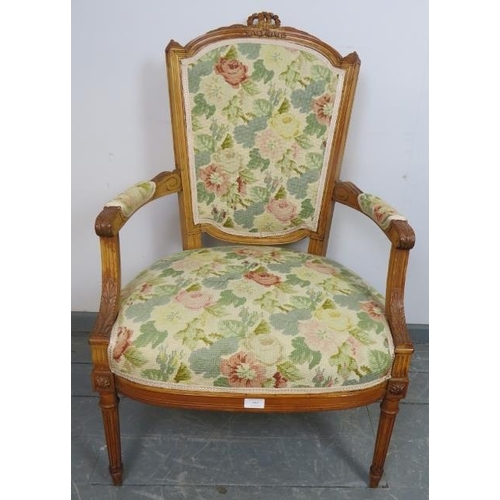 845 - A vintage French fruitwood tapestry seat open sided armchair with carved cornice, on tapering reeded... 